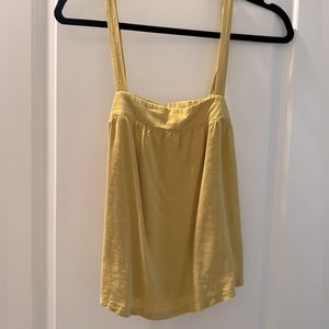 Buttons Along side Slight Stretch on back Straps are Not Adjustable